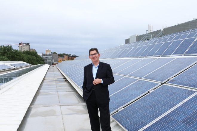 UNSW president and vice-chancellor, Professor Ian Jacobs. The 142kW array is part of the 692kW of solar PV arrays currently installed across rooftops at the UNSW Kensington campus. Photo supplied by UNSW